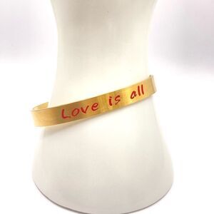 Gold love is all message cuff bracelet